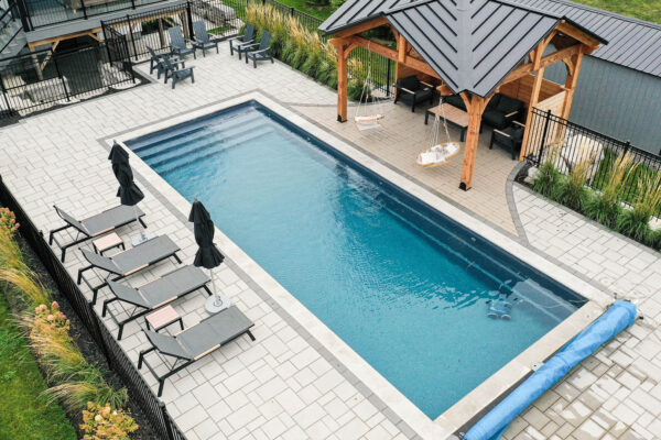 Backyard Landscape Design of a Pool and Patio in Ottawa, Kemptville by VS Landscape
